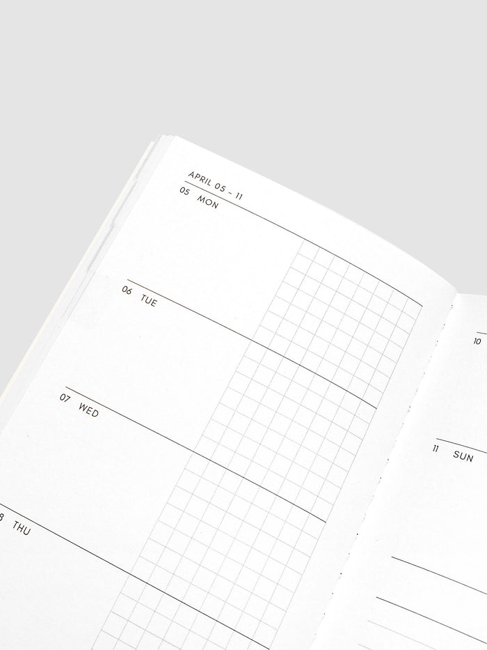 Close-up of the top of the left page of the Jan–Jun 2027 Dated Travel Notebook, showing the split daily columns with open space and graph sections