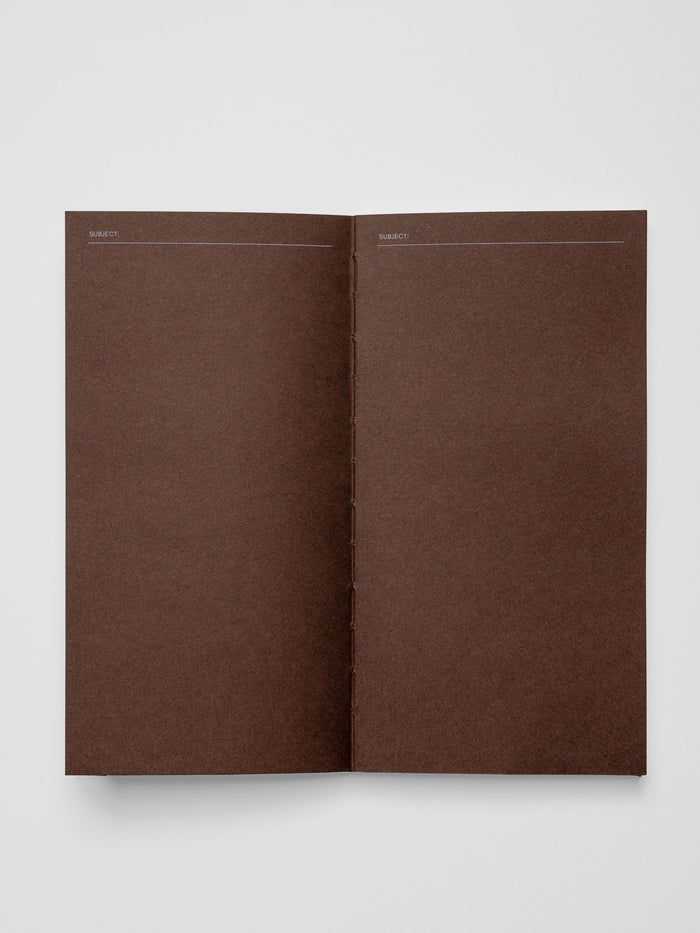 Common Thread Notebook showing the brown interior pages.
