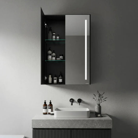 Matte black double door bathroom mirror cabinet with LED strip light and open glass shelves with toiletries - Glazonoid