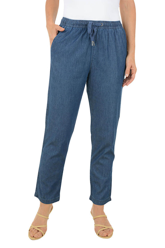 Blue denim pants worn by a person on a white background