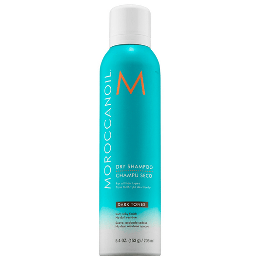 Bottle of Dry Shampoo for Dark Tones | Moroccanoil with turquoise and white packaging and orange lettering, designed to refresh hair with a soft, silky finish without dull residue.