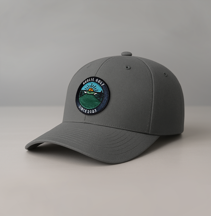 Haze Gray Early Riser Men’s Golf Hat with sunrise patch and Hoolie pin flag