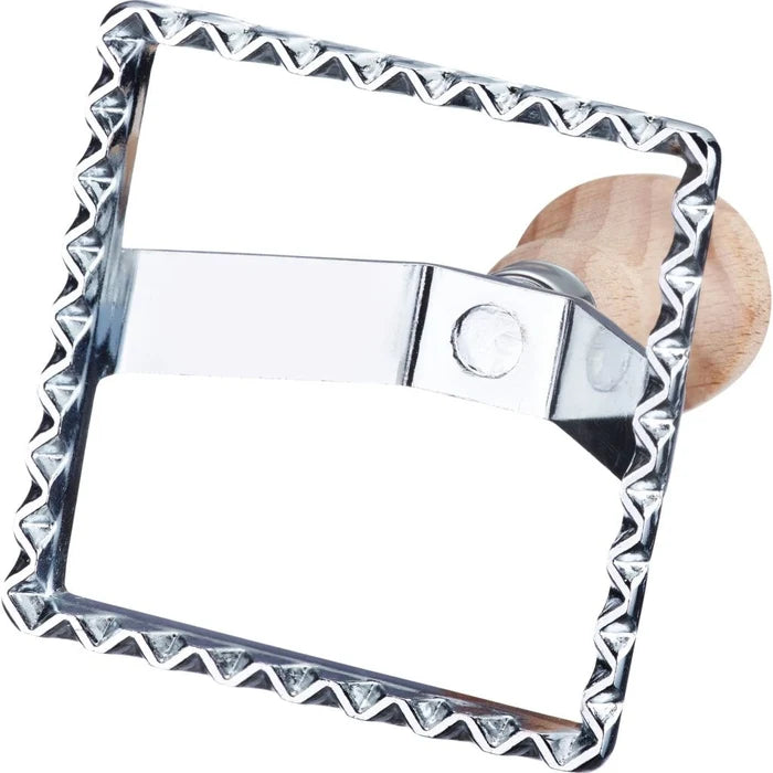 Metallic square-shaped pasta cutter with a wooden handle on a white background.
